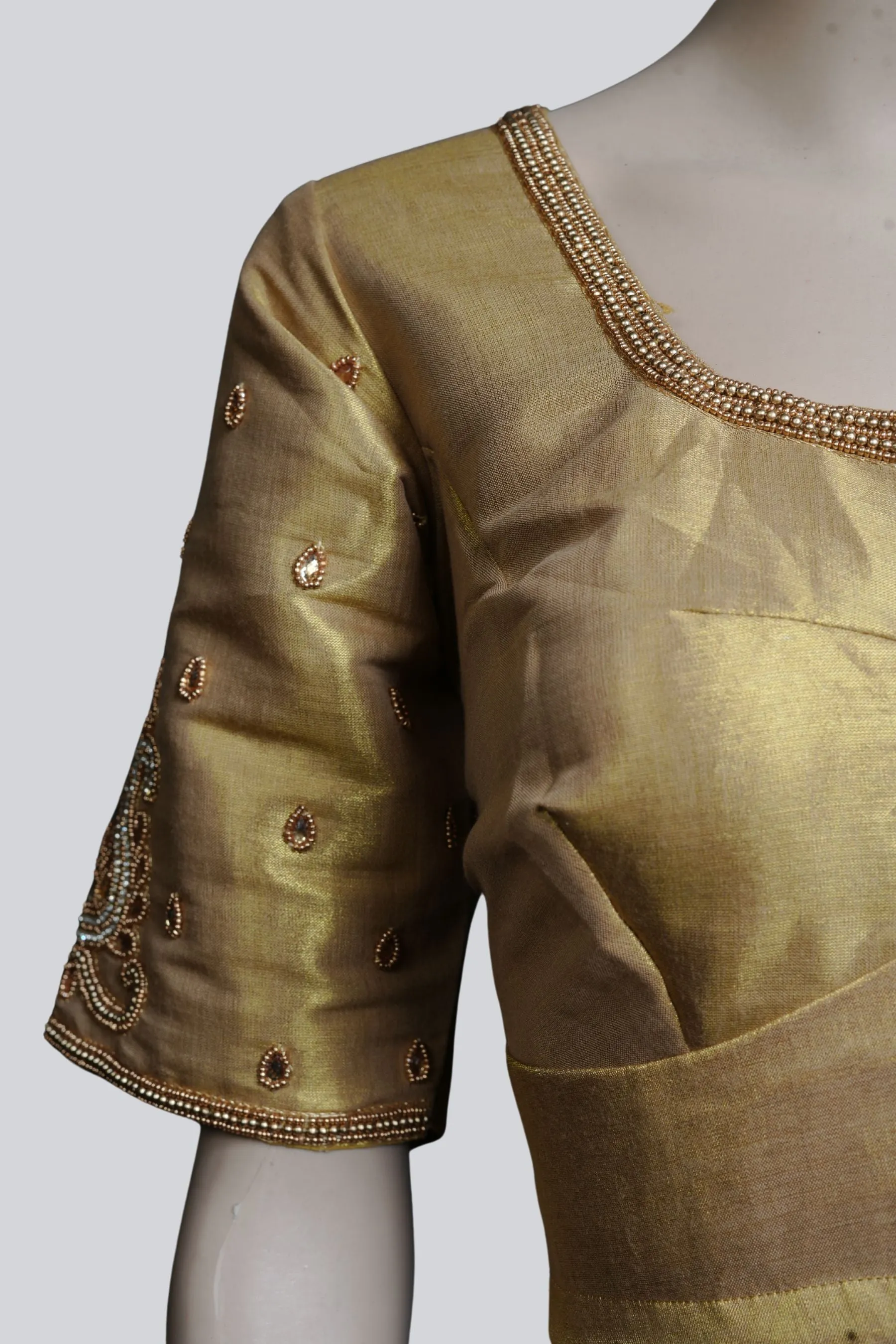 Graceful Bridal Elegance: Maggam Work Blouse with Stunning Back Tassels