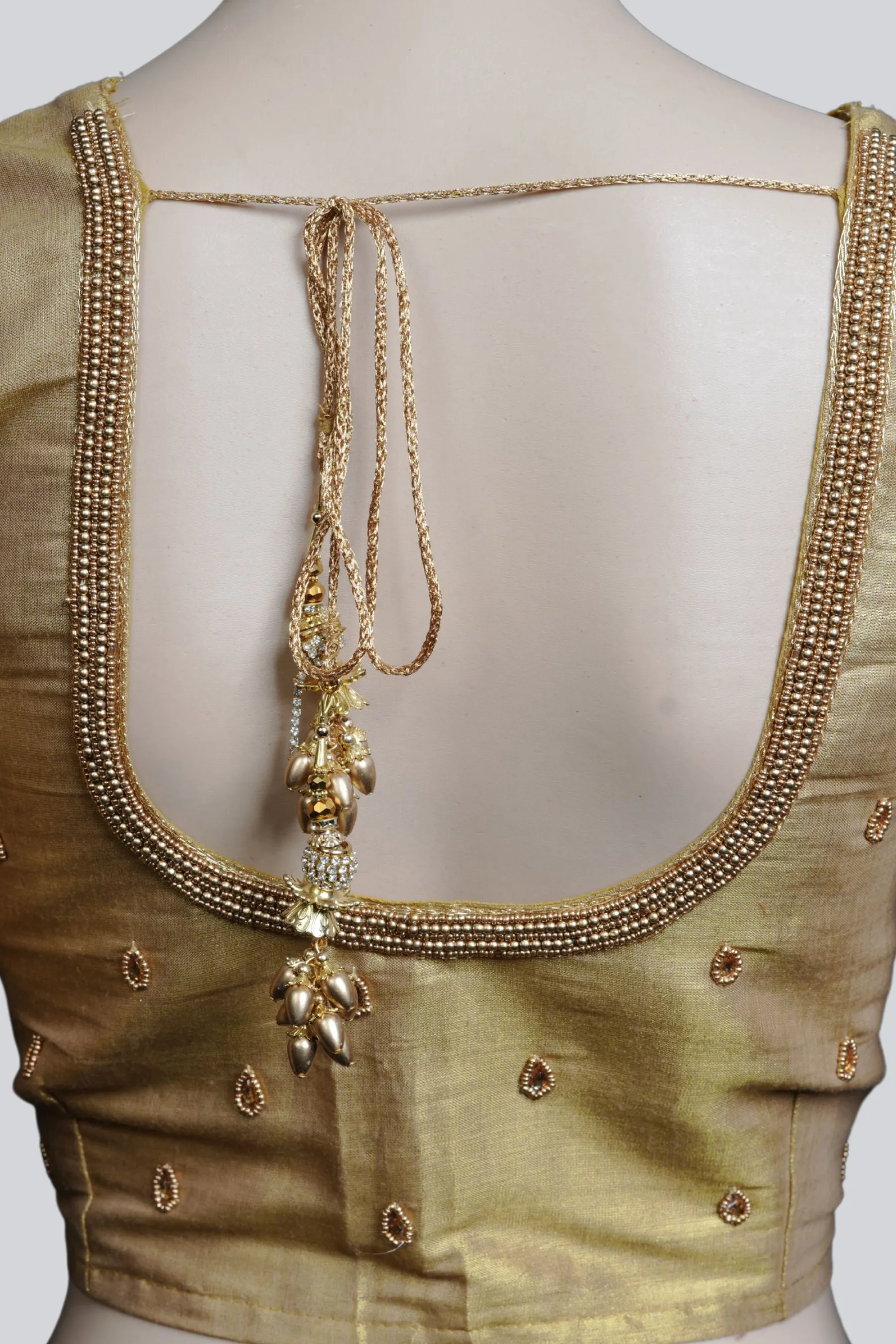 Graceful Bridal Elegance: Maggam Work Blouse with Stunning Back Tassels