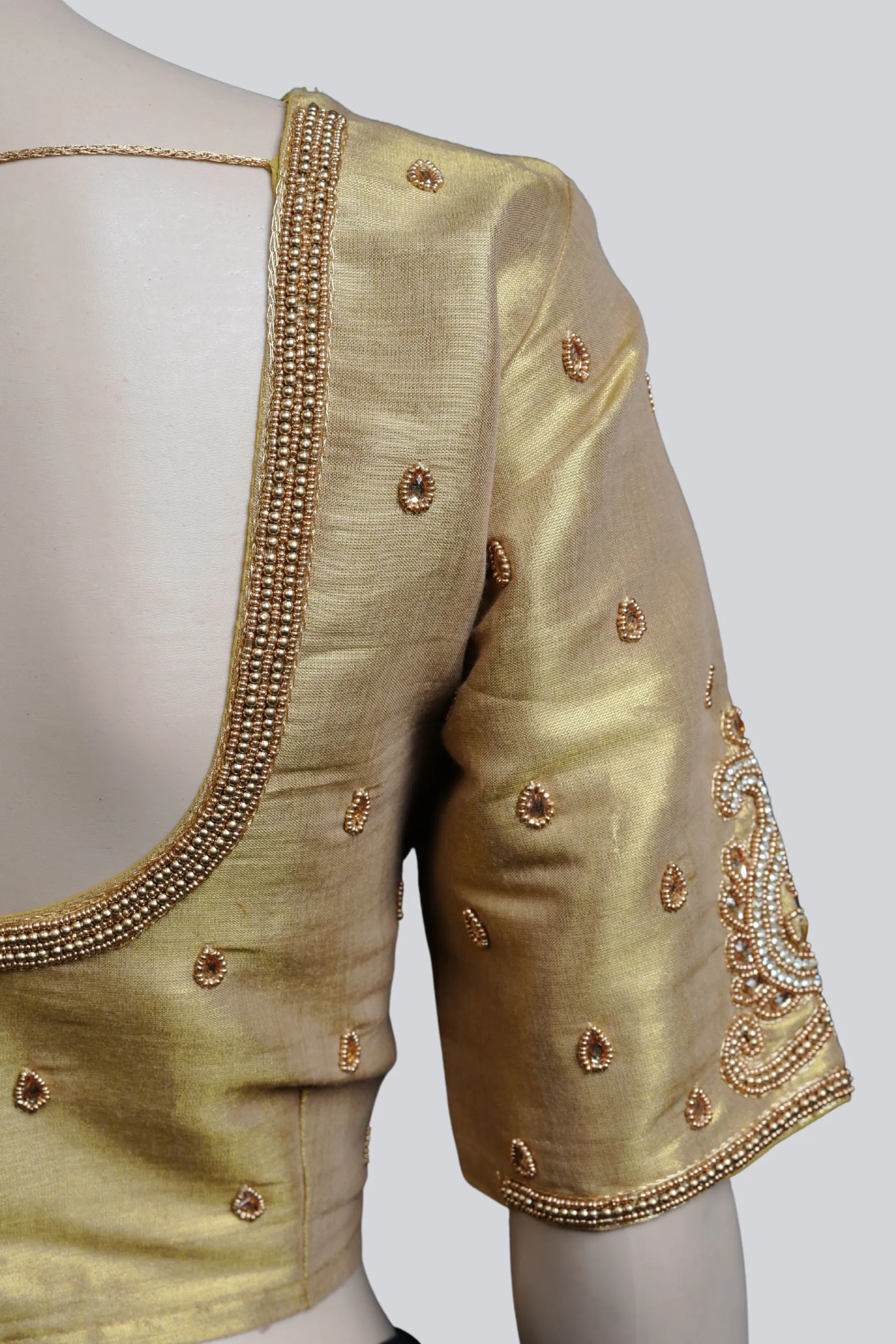 Graceful Bridal Elegance: Maggam Work Blouse with Stunning Back Tassels