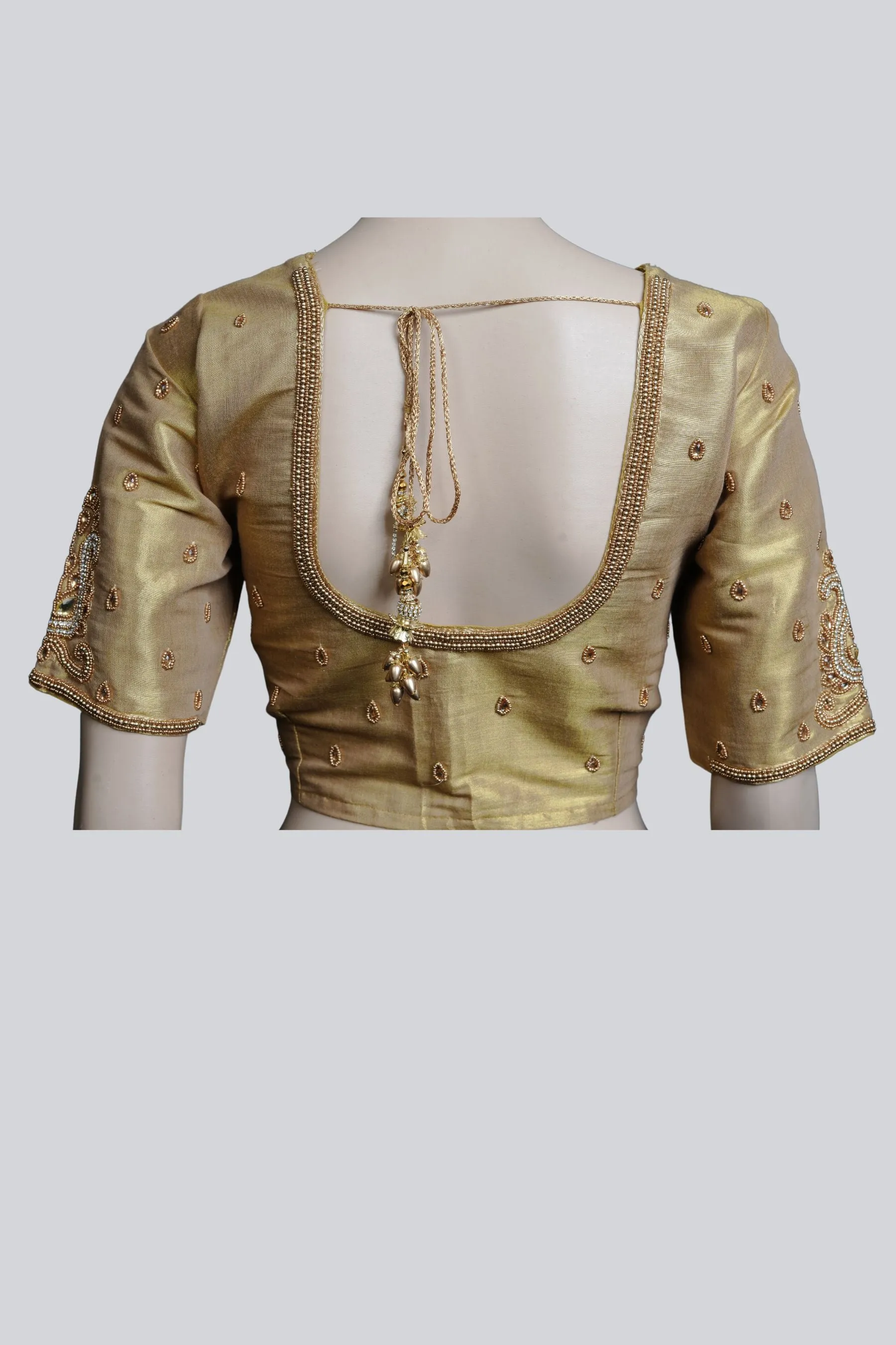 Graceful Bridal Elegance: Maggam Work Blouse with Stunning Back Tassels